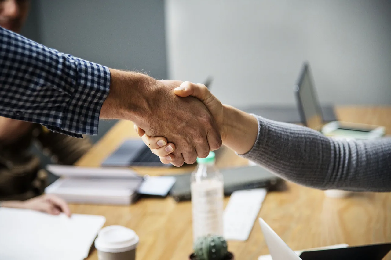 A handshake representing CSA’s partnership approach